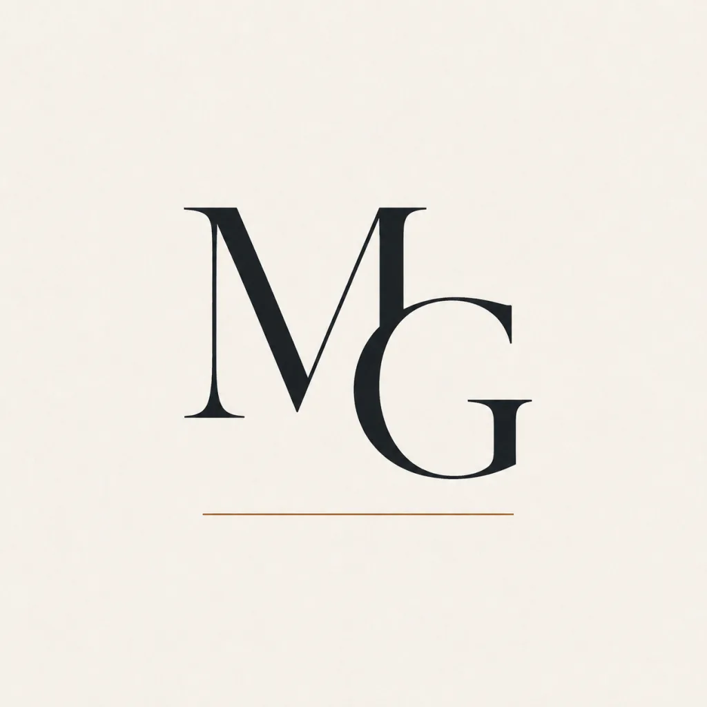 Monogramme MG de Mireille Guyennet, lettres encre soulignées d’un filet ocre